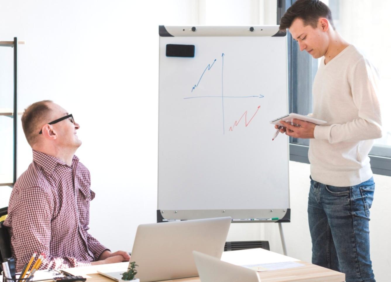 Person reviewing financial documents and planning budget